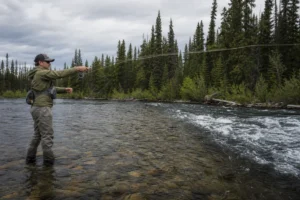Canadian angler applying advanced fly fishing streamer tactics in realistic northern water conditions