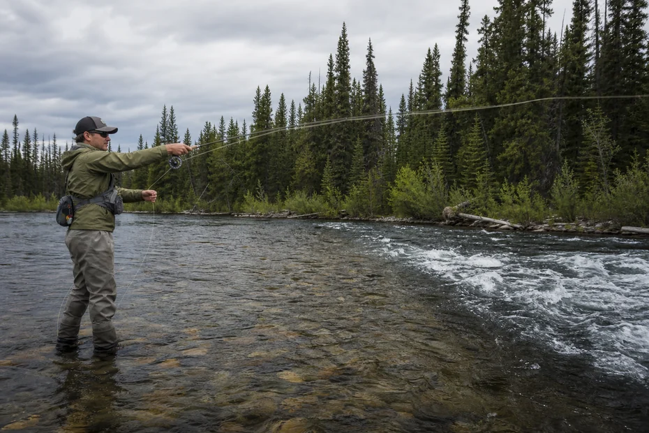 Canadian angler applying advanced fly fishing streamer tactics in realistic northern water conditions
