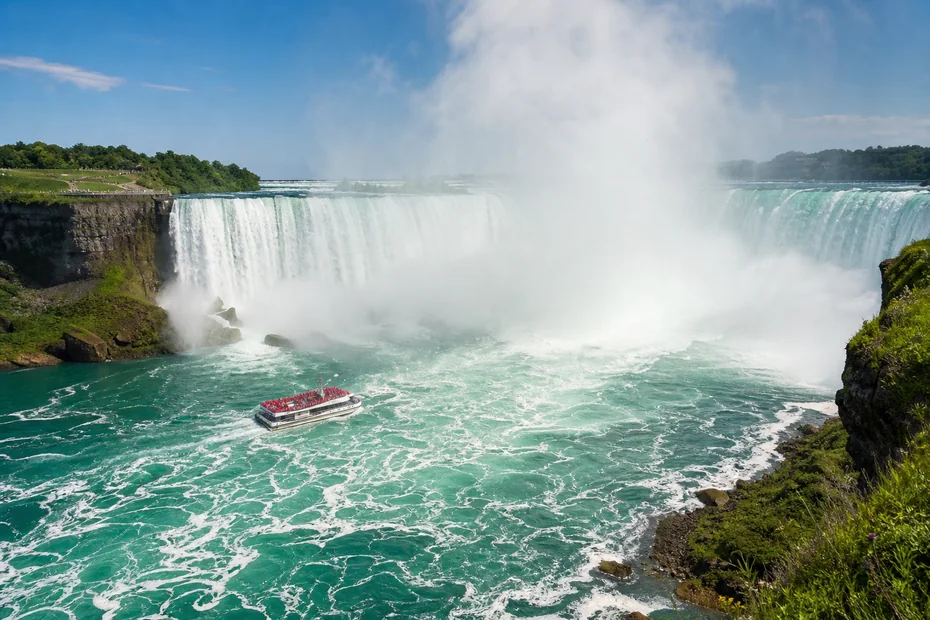 Horseshoe Falls in Niagara Falls Canada with a sightseeing boat approaching the mist